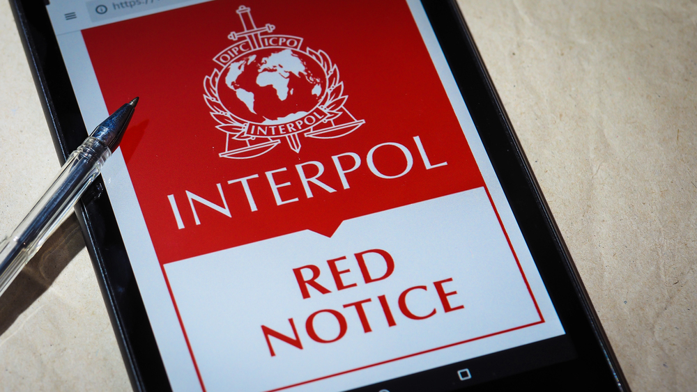 INTERPOL Red Notice shown on a smartphone